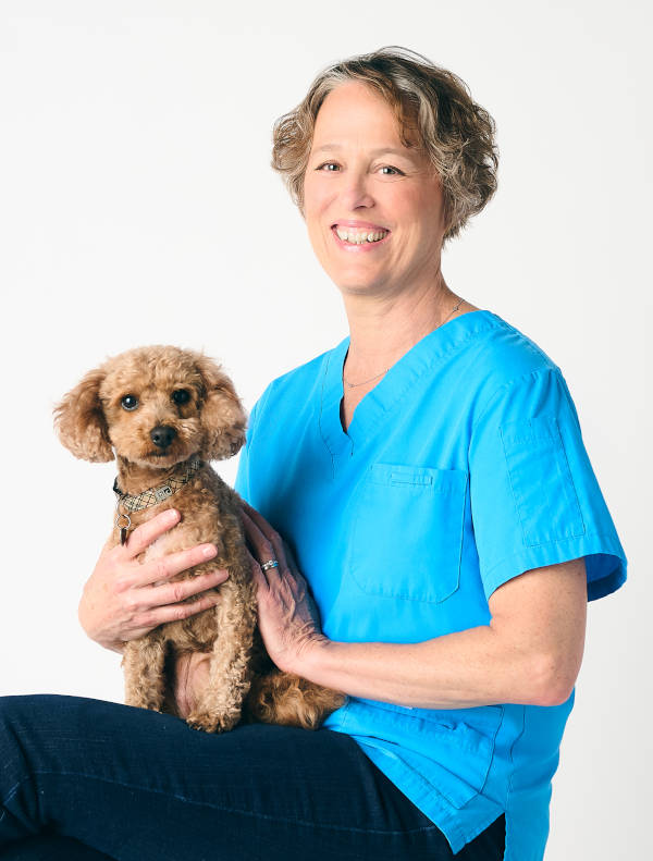 Jackie the vet and her dog, posing